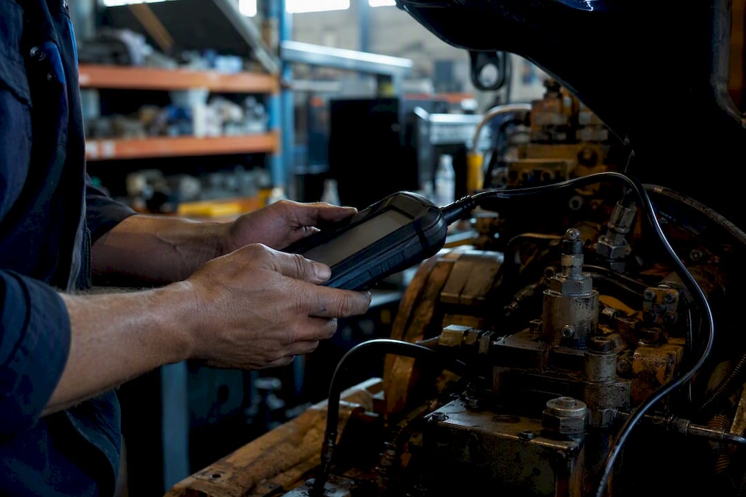 Technician inspecting equipment for warranty repair