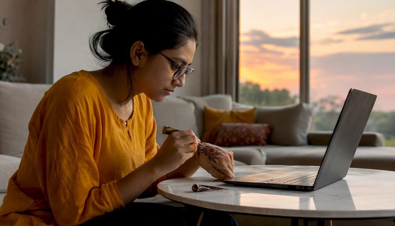 Woman in online private henna lesson at home