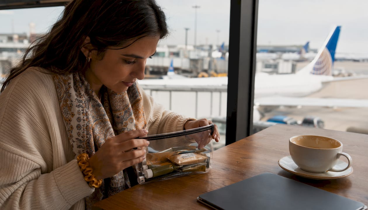 Traveler packing henna paste in clear toiletry bag