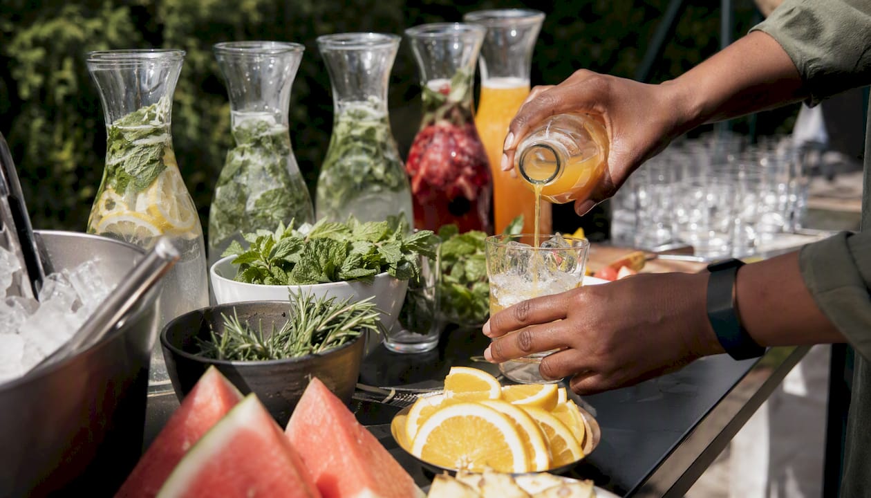 Hand preparing a refreshing mocktail drink