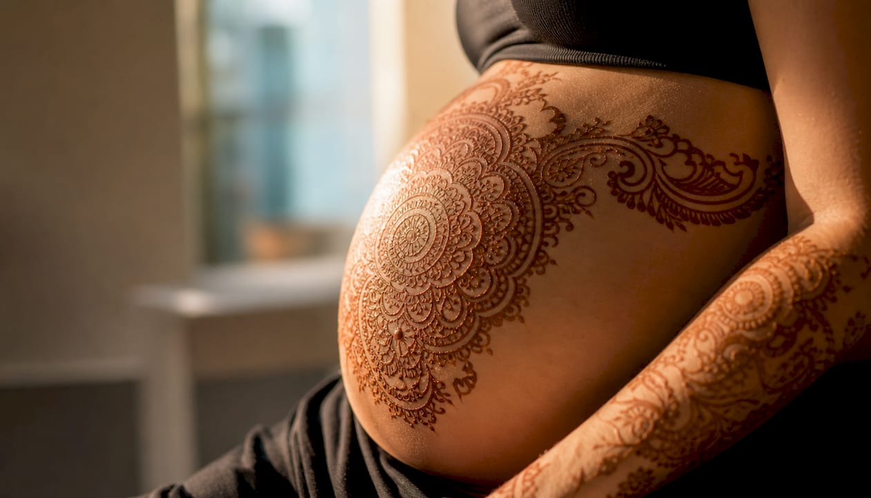 Floral and mandala belly henna design close-up