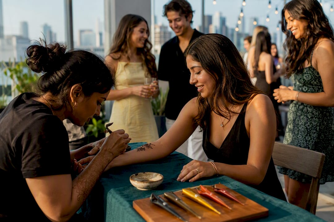 Henna artist serving guests at graduation party