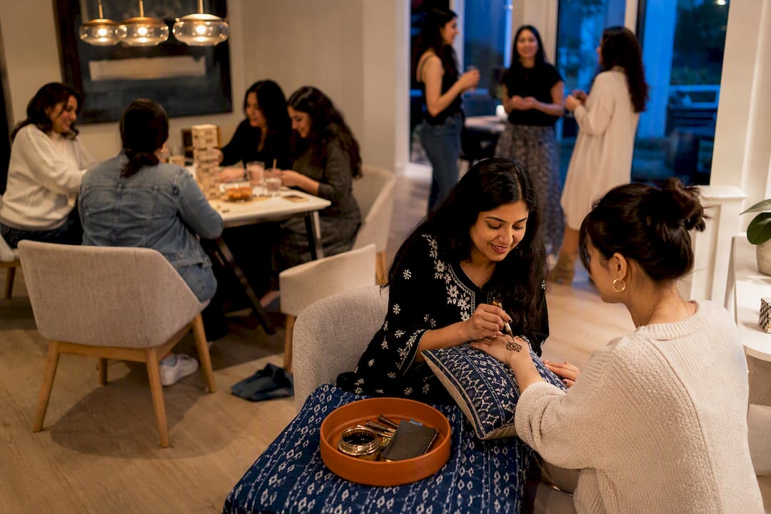 Guests enjoying a home henna party