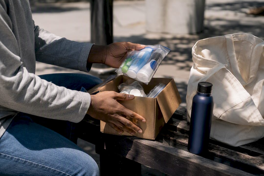 Hands offering food during community ministry