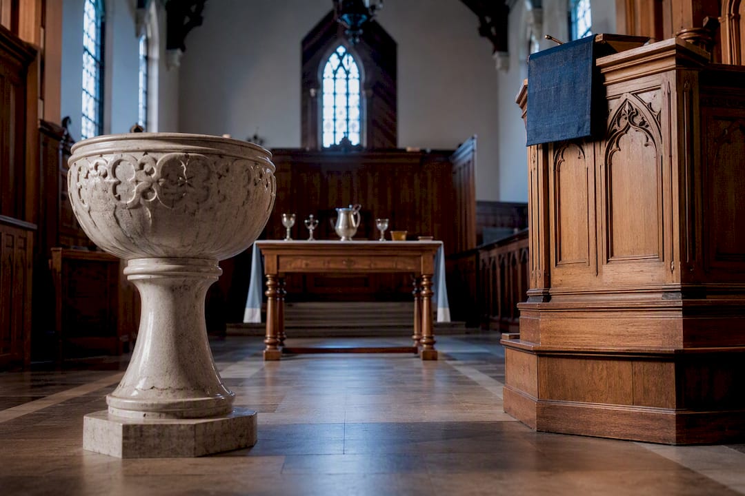 Church sanctuary with pulpit and baptismal font