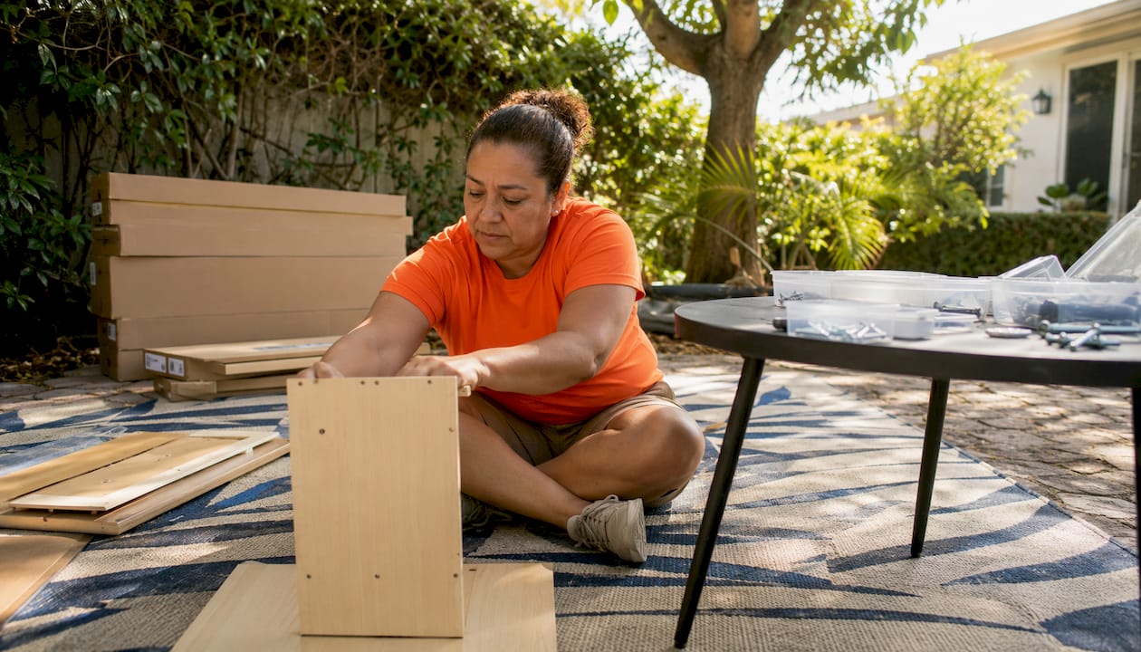 Handyman assembling desk in garage