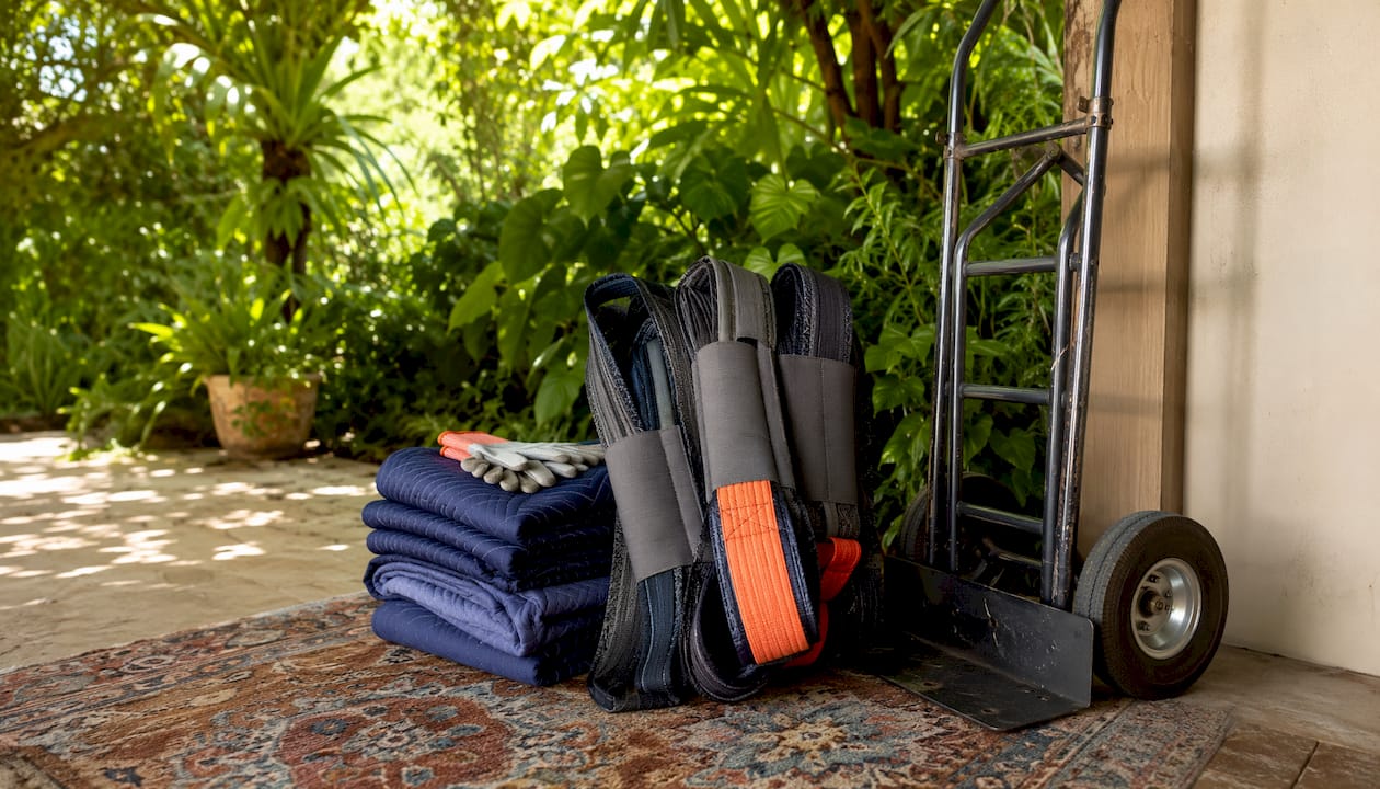 Gun safe moving equipment neatly arranged outdoors