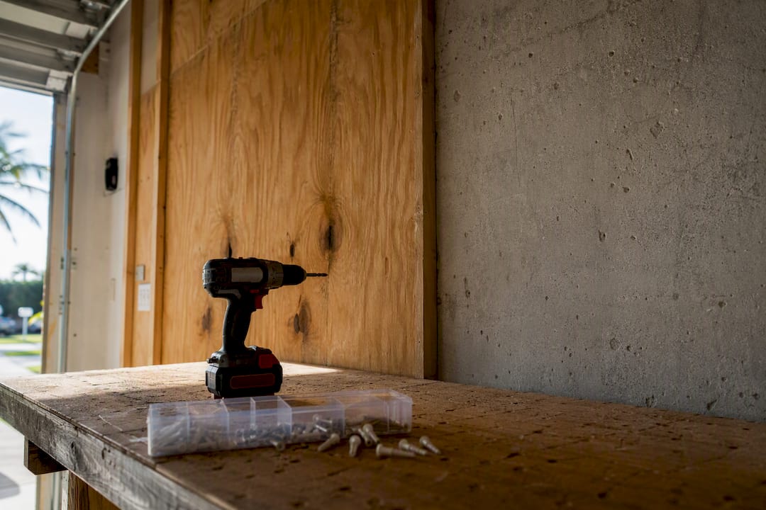 Drywall with studs and masonry wall side by side