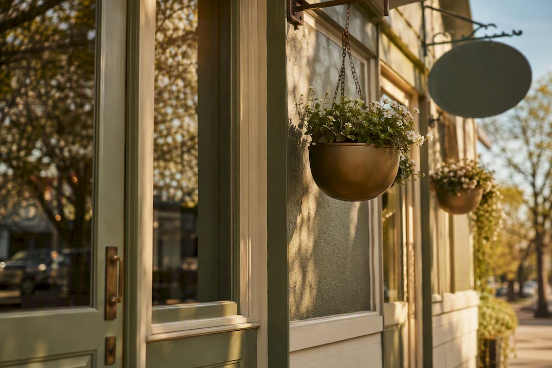 Warmly lit local storefront exterior detail