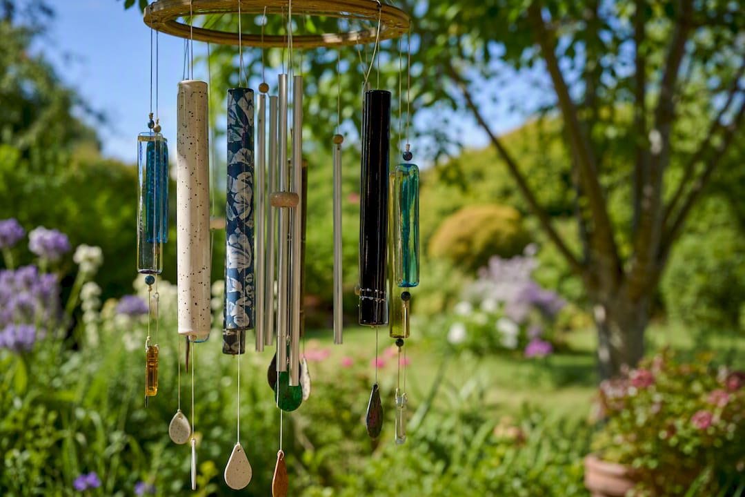 Varied material wind chimes hanging outdoors