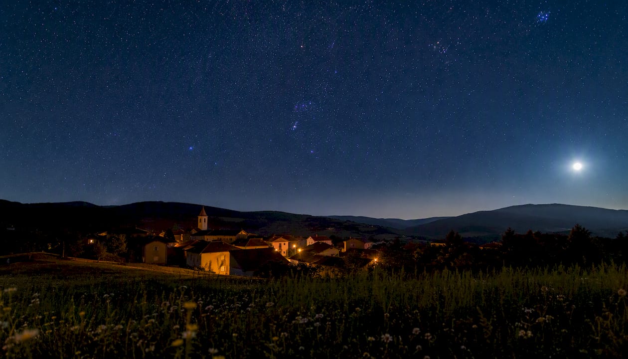 Clear night sky with bright constellations visible