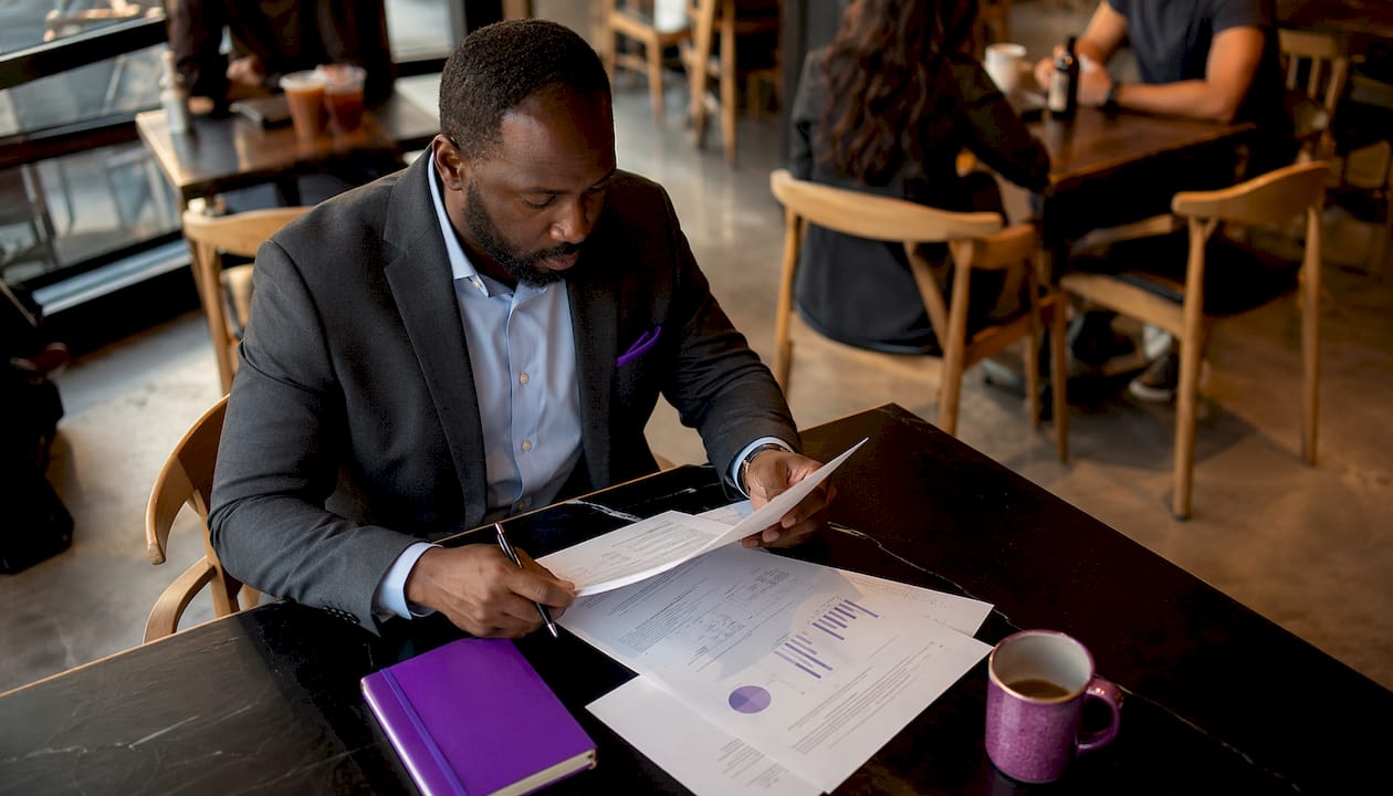 Fractional CMO reviewing printed strategy documents