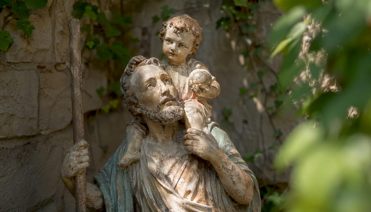 Close-up of historic St. Christopher statue indoors