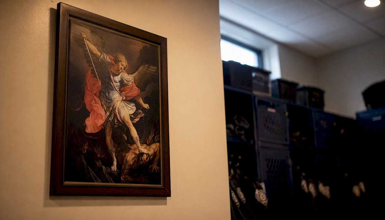 Framed St. Michael art in police locker room