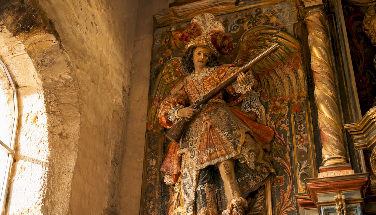 Colonial Latin American archangel painting with arquebus