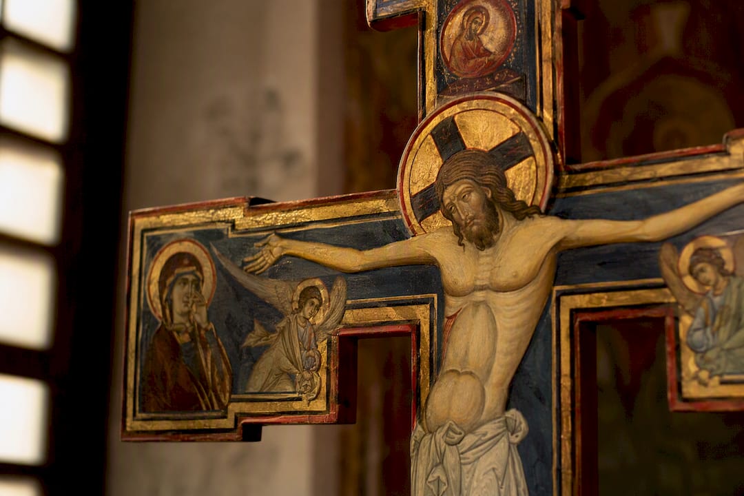 Close-up of Byzantine style Christ figure on cross