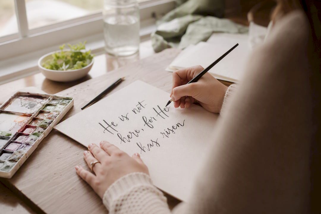 Hand lettering Easter scripture verse on paper