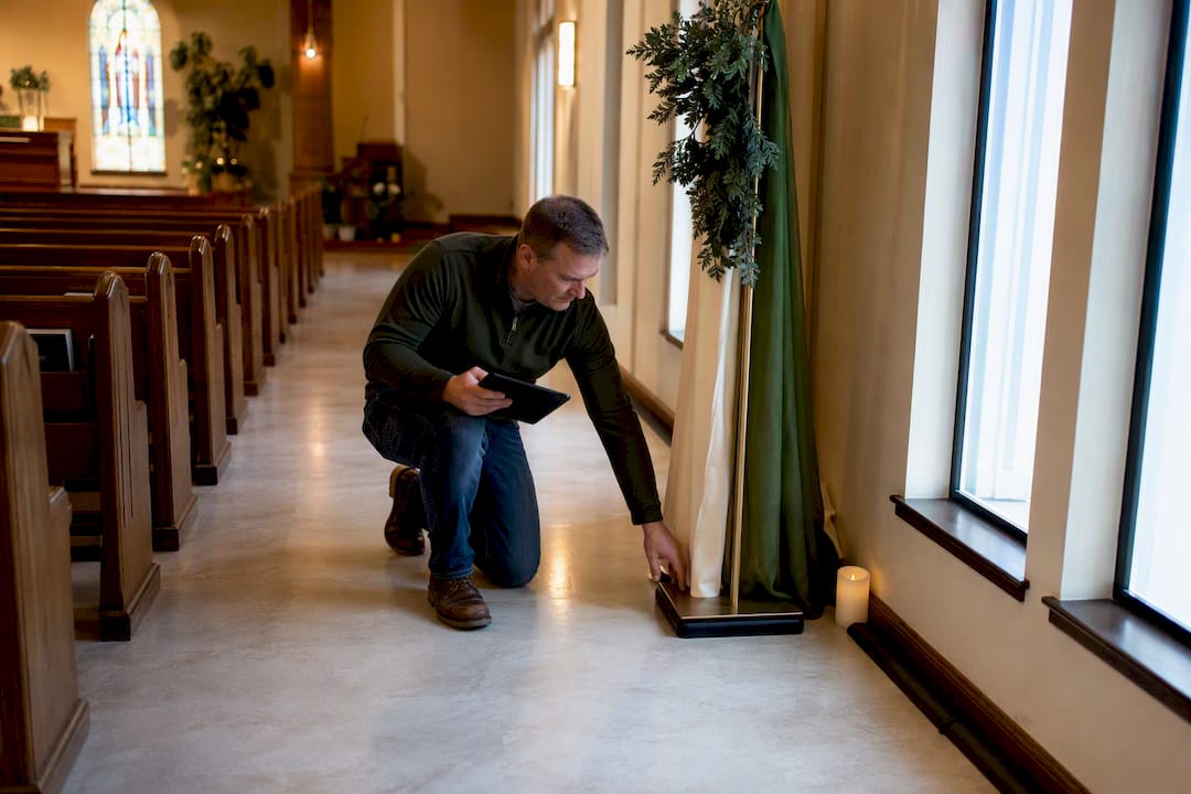 Church volunteer checking safe decor placement