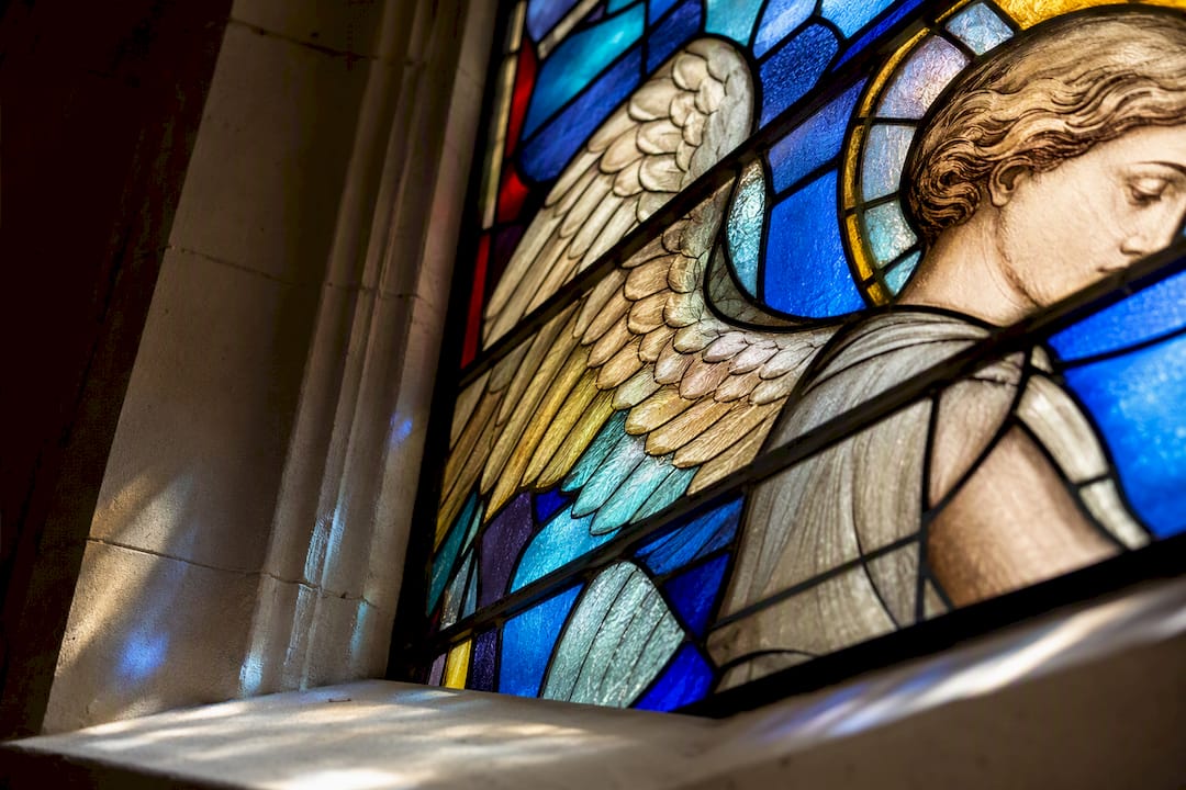Guardian angel stained glass detail in chapel