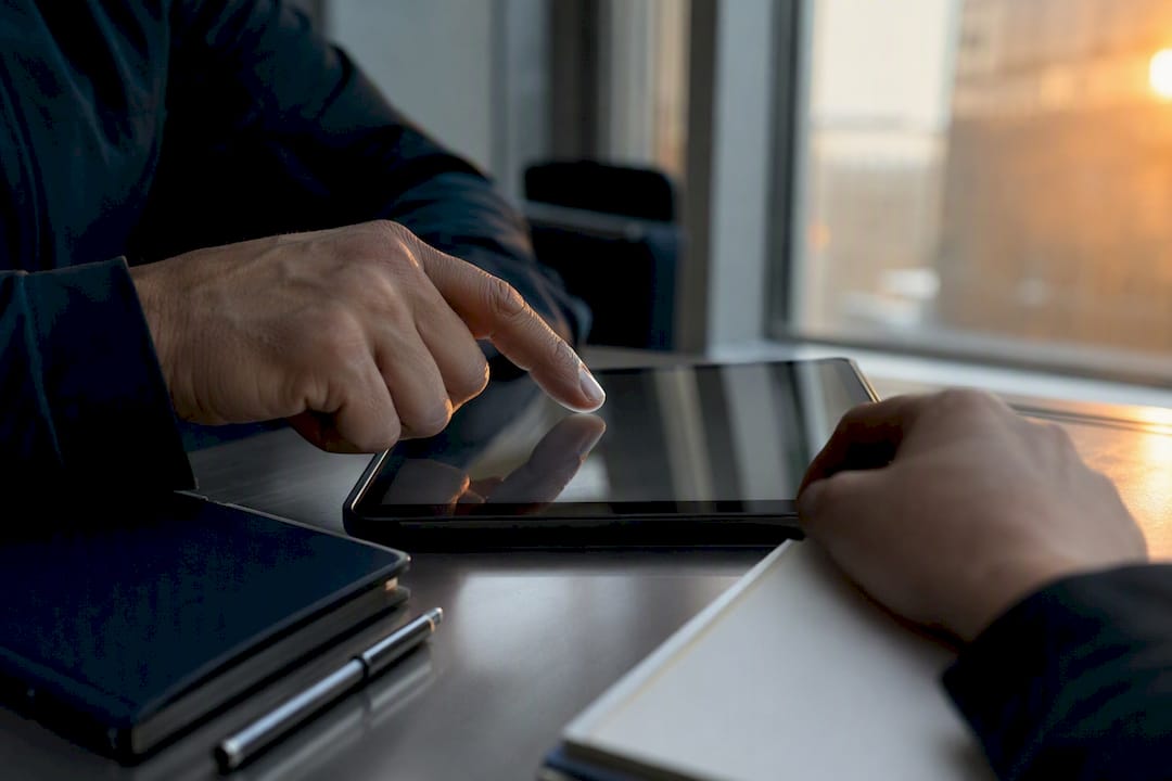 Mobile access credentials: what security managers need to know 8 Hands reviewing security logs on tablet