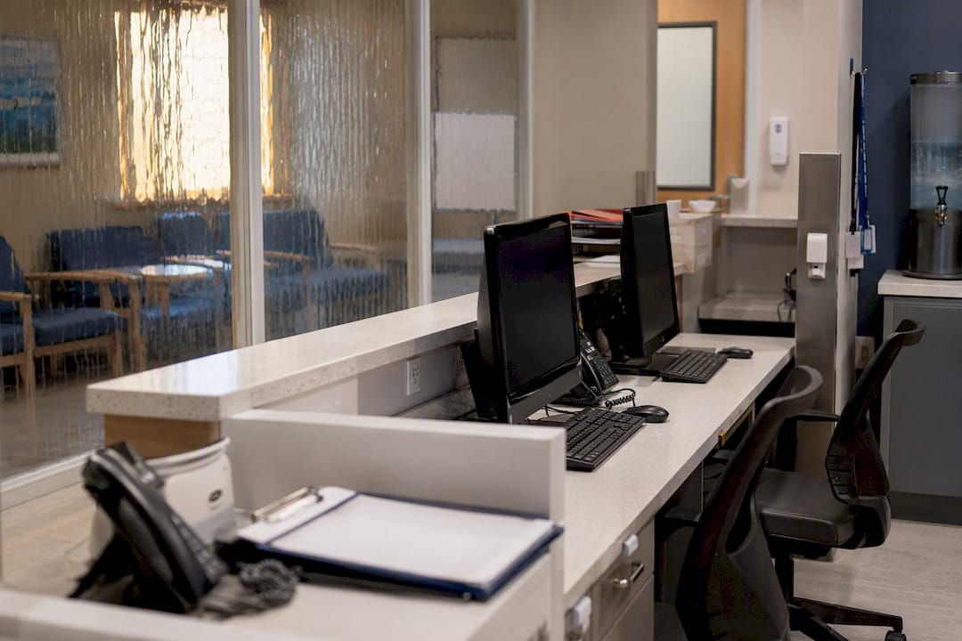 What every healthcare security policy must actually cover 8 Hospital nursing station with privacy screens