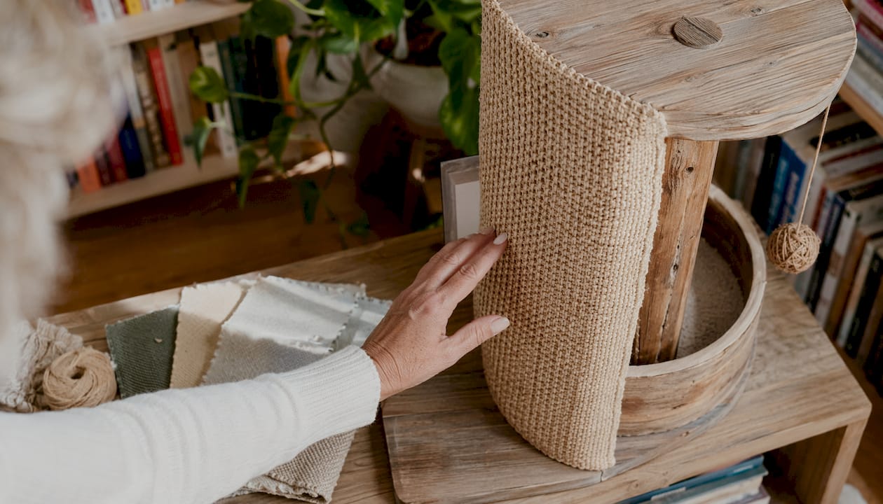 Hand touching eco-friendly materials for cat furniture