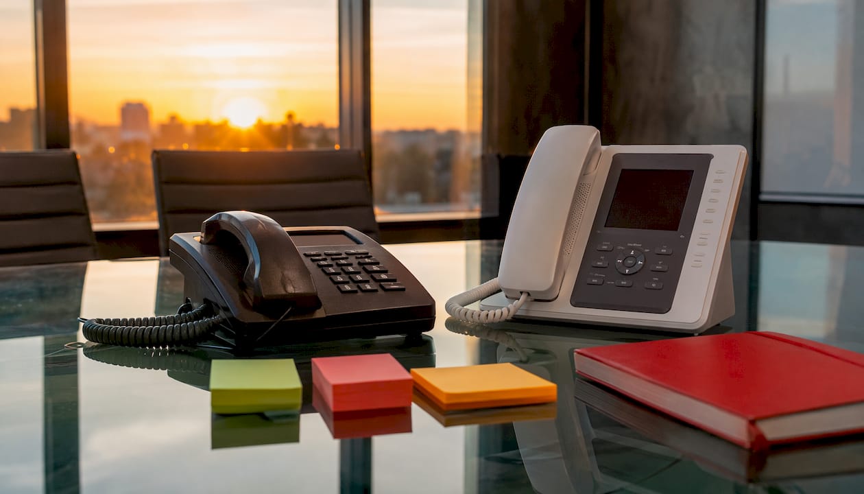 Top-down view comparing VoIP and traditional phones