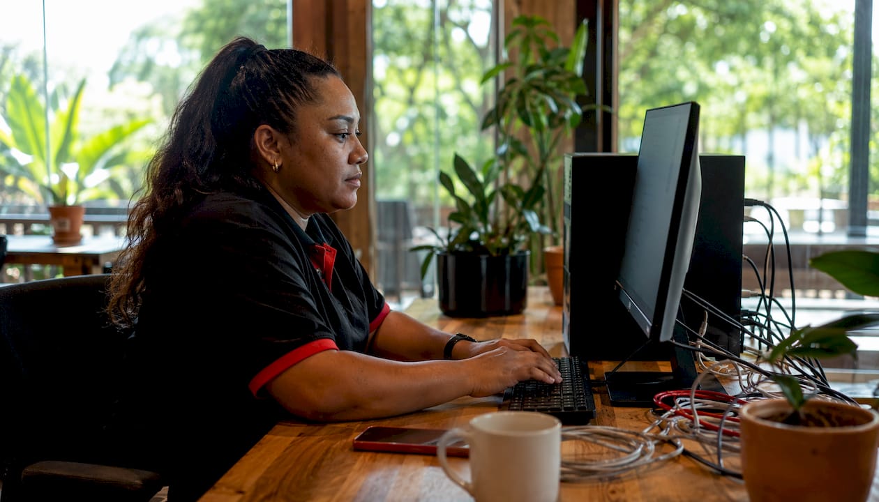 Microsoft 365 Business Premium: the Australian SMB guide 3 Queensland IT technician configuring Microsoft 365 software