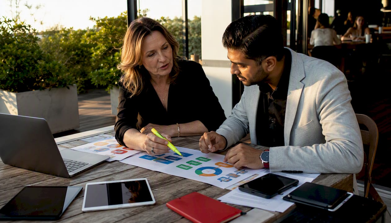 MDM for small business: the Australian SMB guide 5 Business partners reviewing MDM solution comparison charts