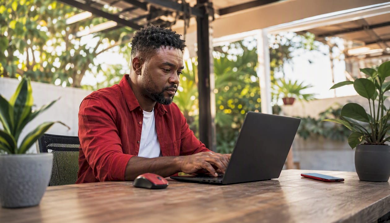 Windows update management: a practical guide for IT teams 3 Hands typing on laptop configuring Intune updates
