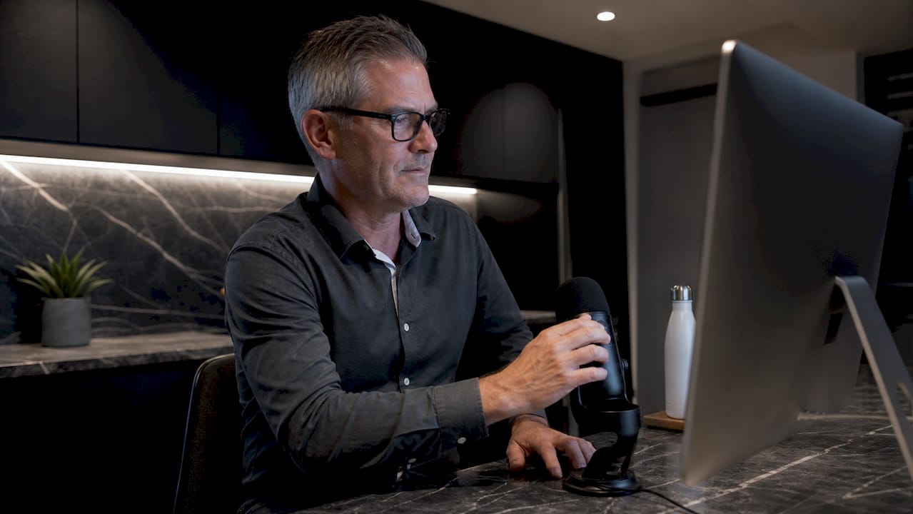 Man adjusting text-to-speech settings at desk
