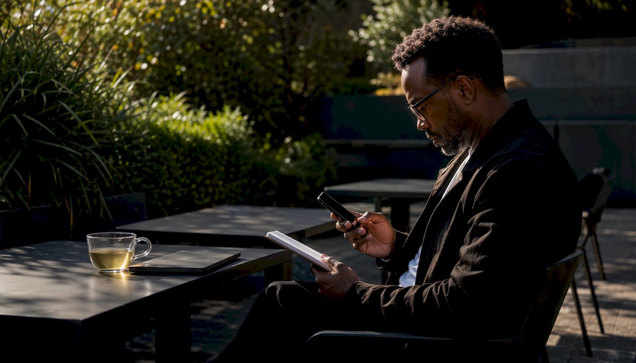 Man preparing podcast feed submission notes