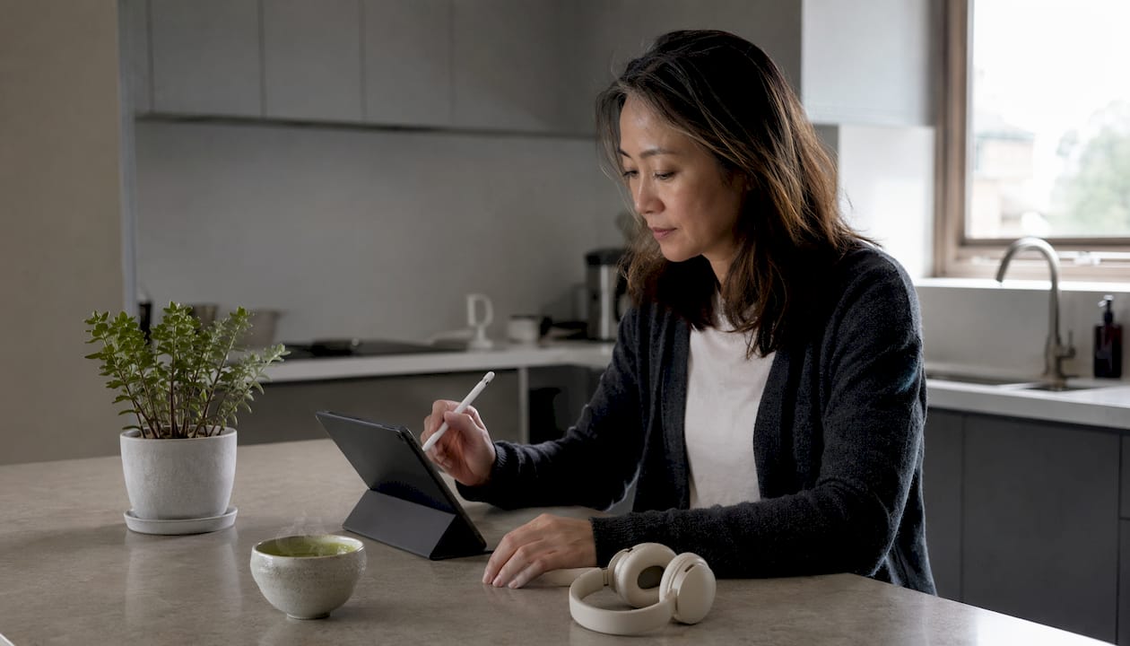 Woman engaging with AI audio workflow at desk