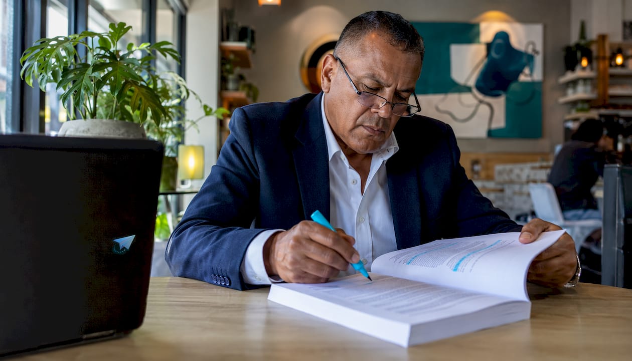 Officer studying MySuper legislation document