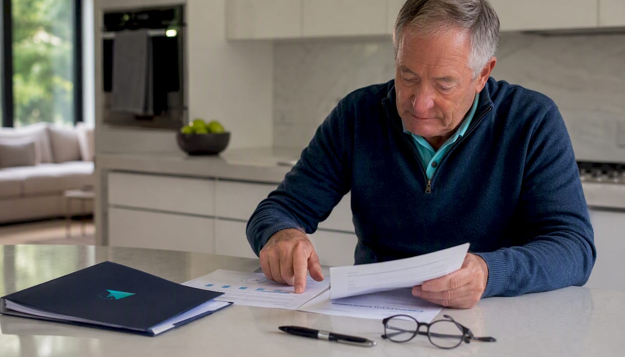 Close-up of hands reviewing asset valuation papers