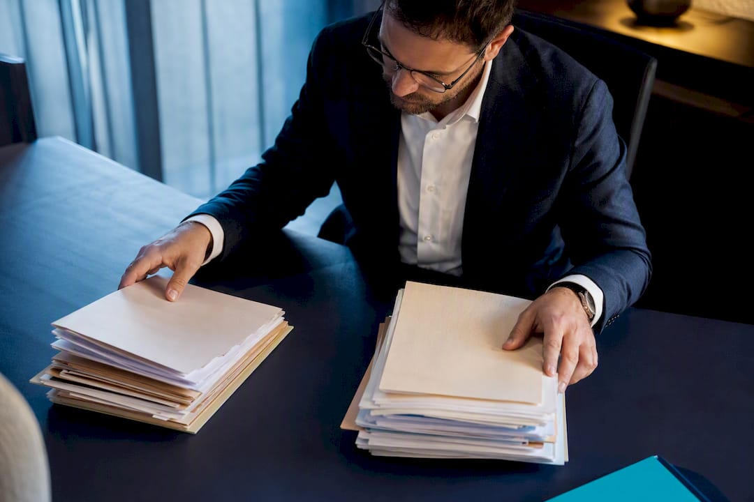 Tax adviser reviewing dividend transaction records