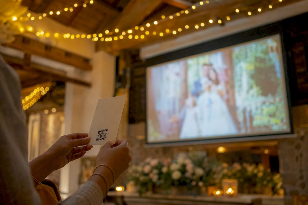 A live wedding photo slideshow, done right, wins the room