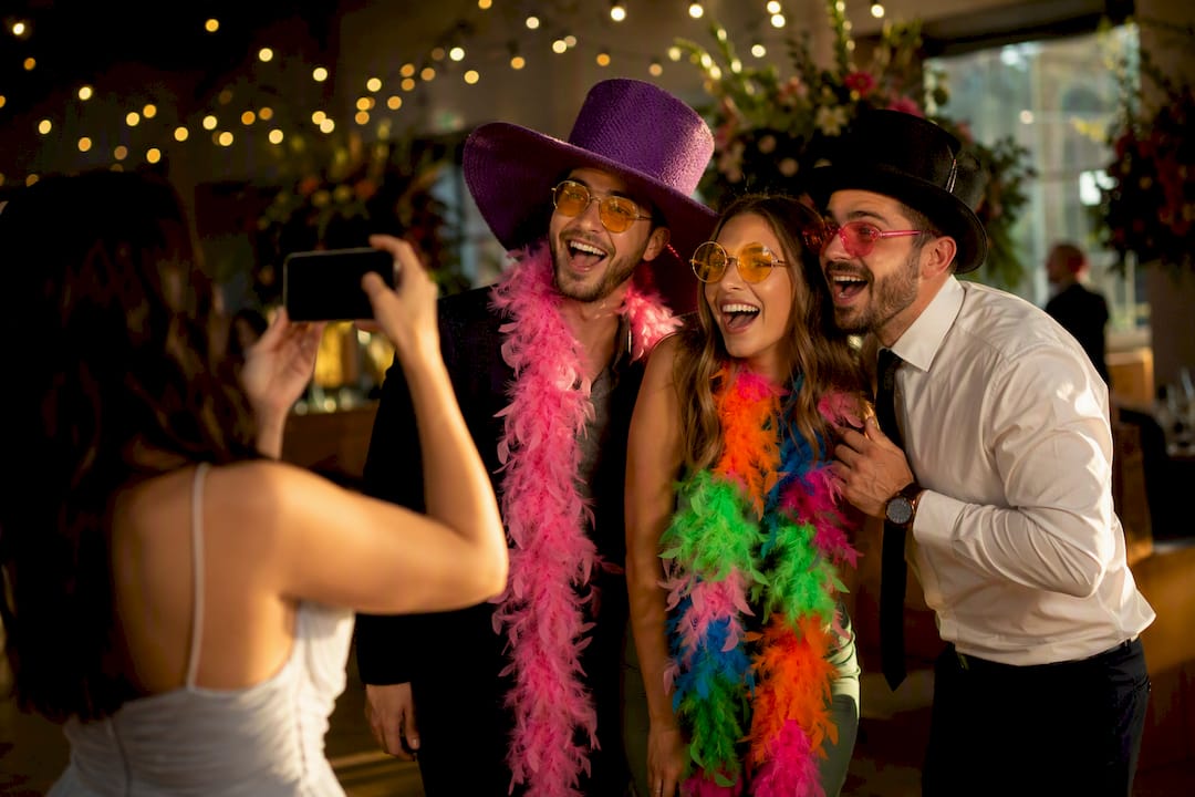 Guests using photo challenge props