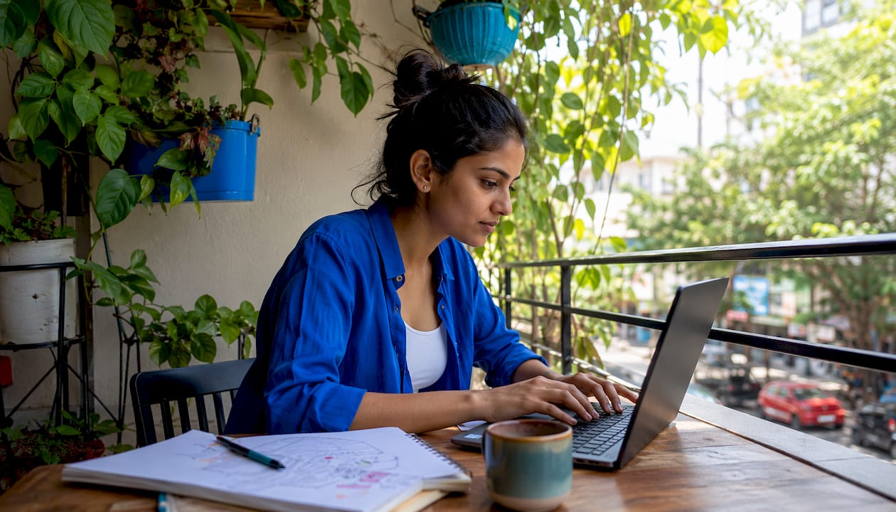 Person using laptop to optimize SEO with AI tools