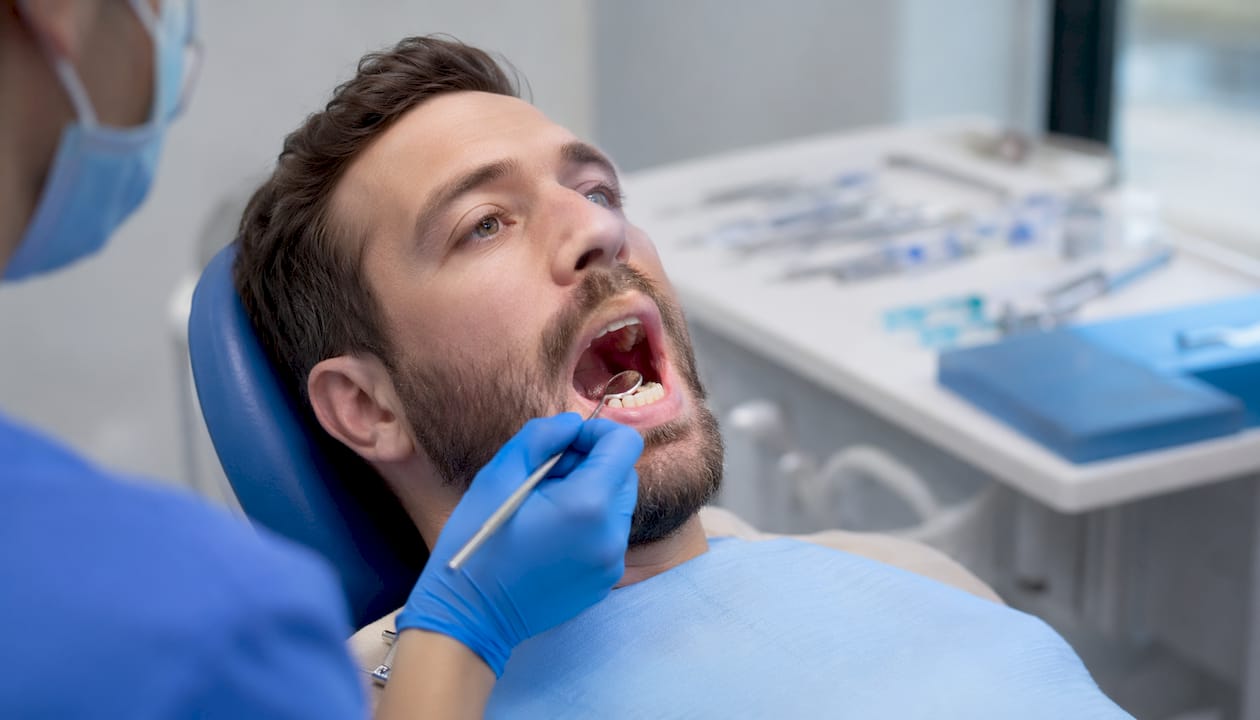 Close-up of healing dental implant post in patient's mouth
