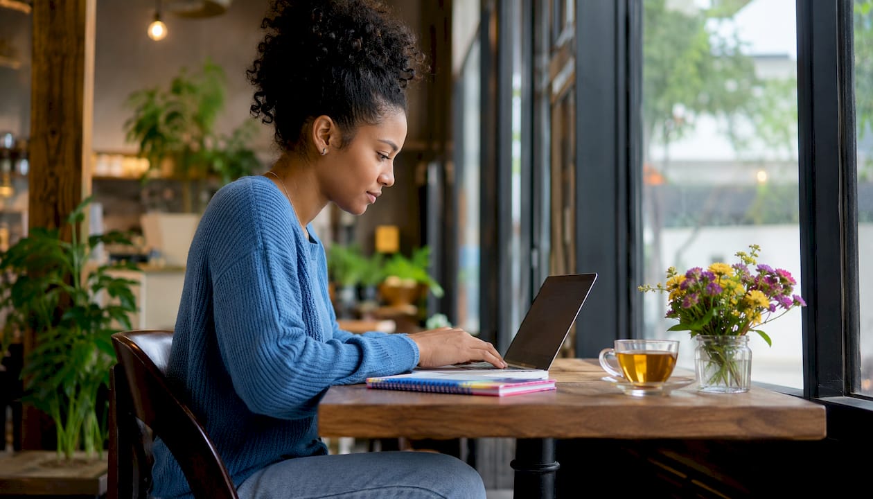 Woman booking dental cleaning appointment online