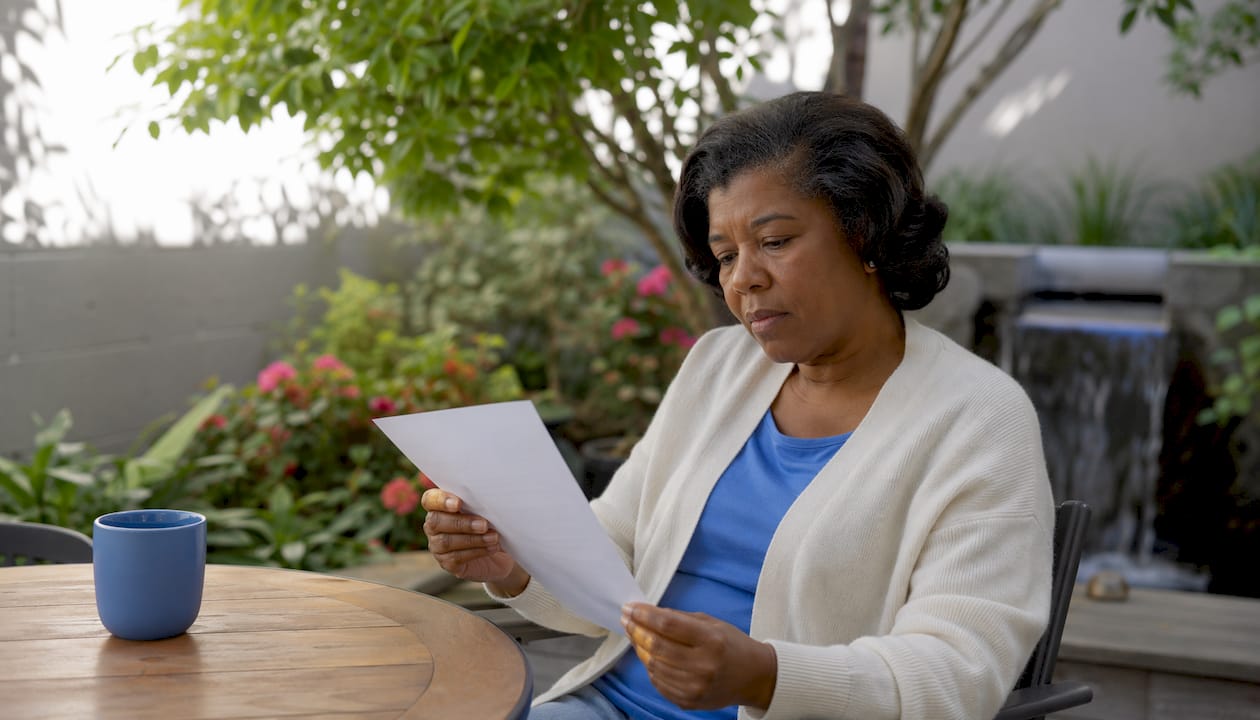 Woman reviewing dental crown cost estimate