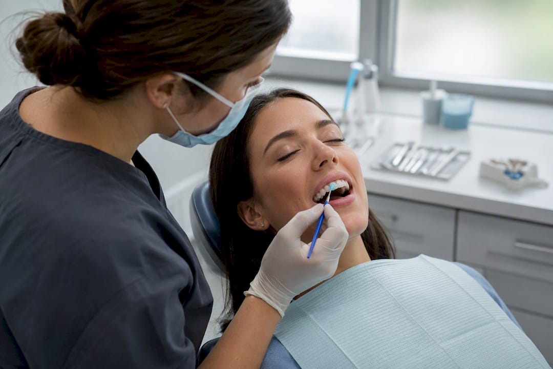 Close-up of dental whitening procedure