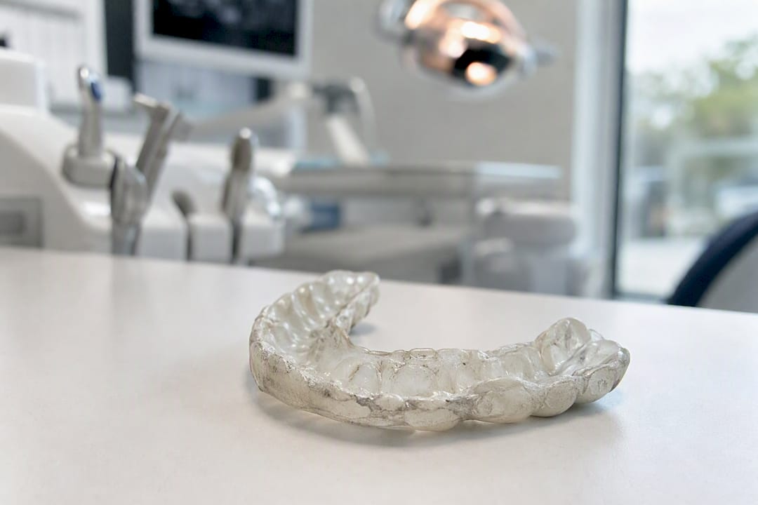 Worn ill-fitting mouthguard with chew marks