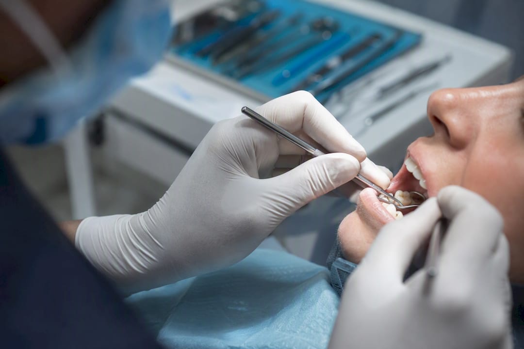Dentist placing composite dental filling