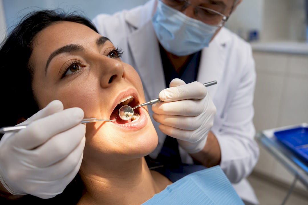 Dentist examining an existing amalgam filling