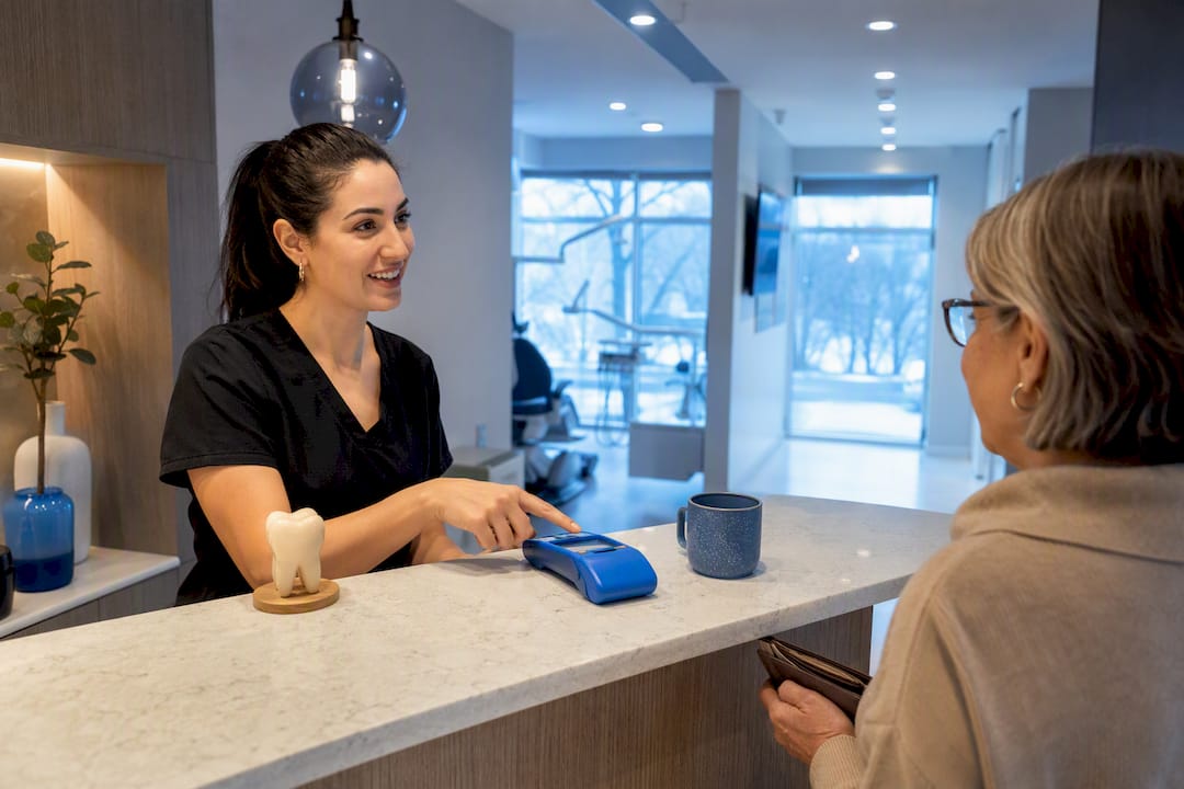 Patient confirming dental coverage at reception