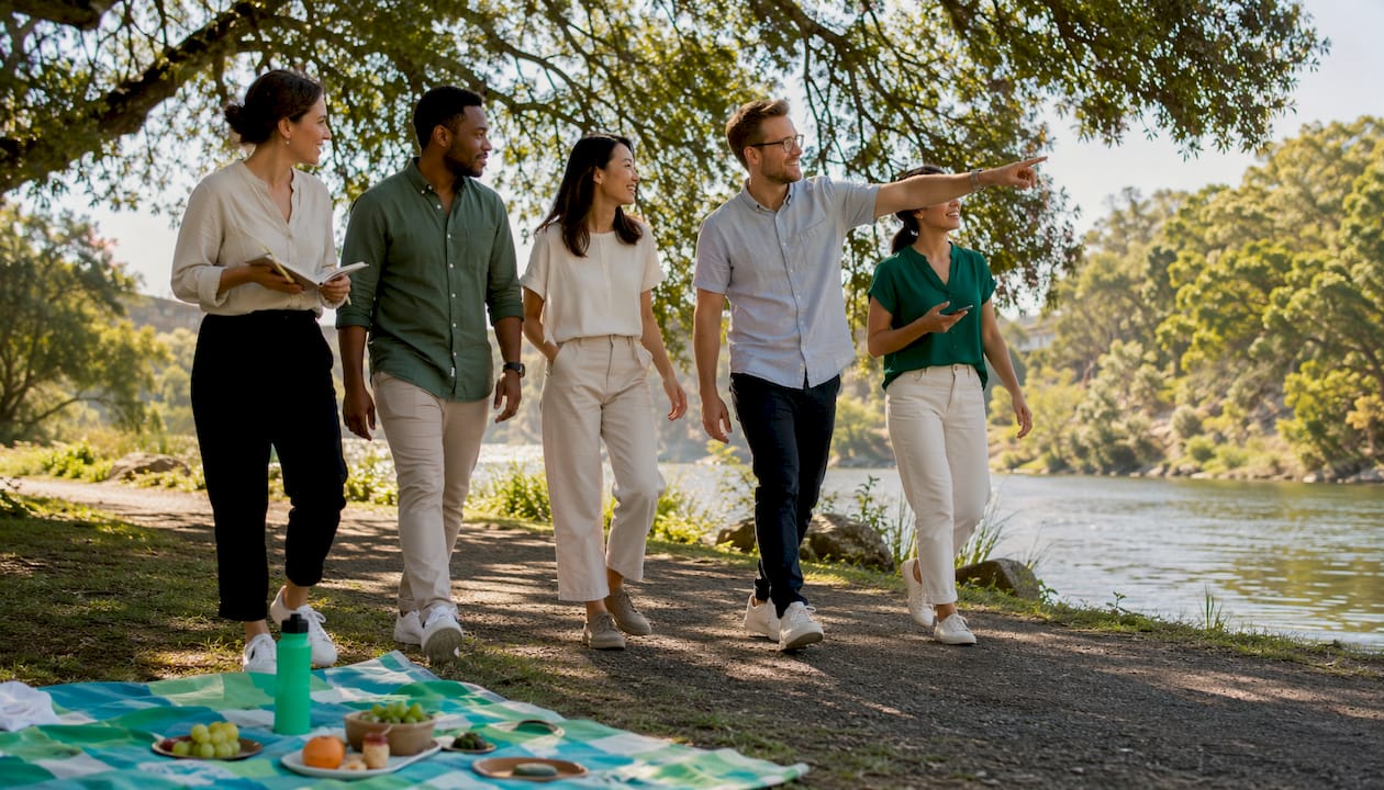 Employees walking outdoors during wellness meeting