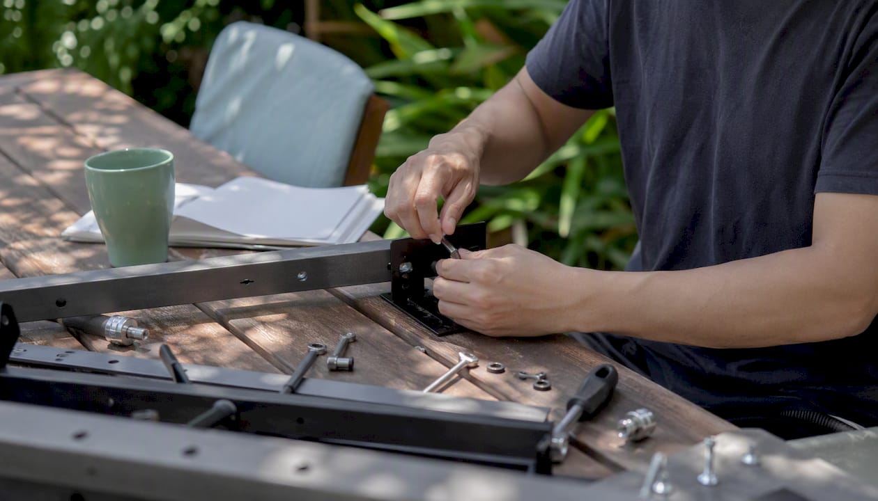Hands assembling training equipment close-up