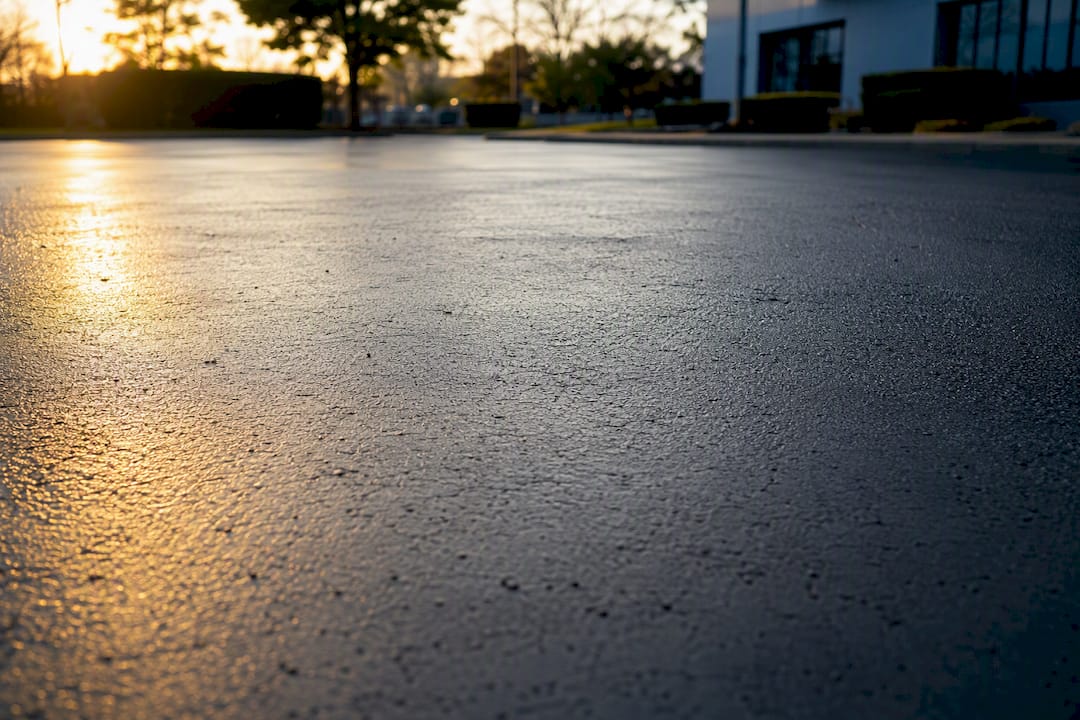 Fresh sealcoat curing on parking lot